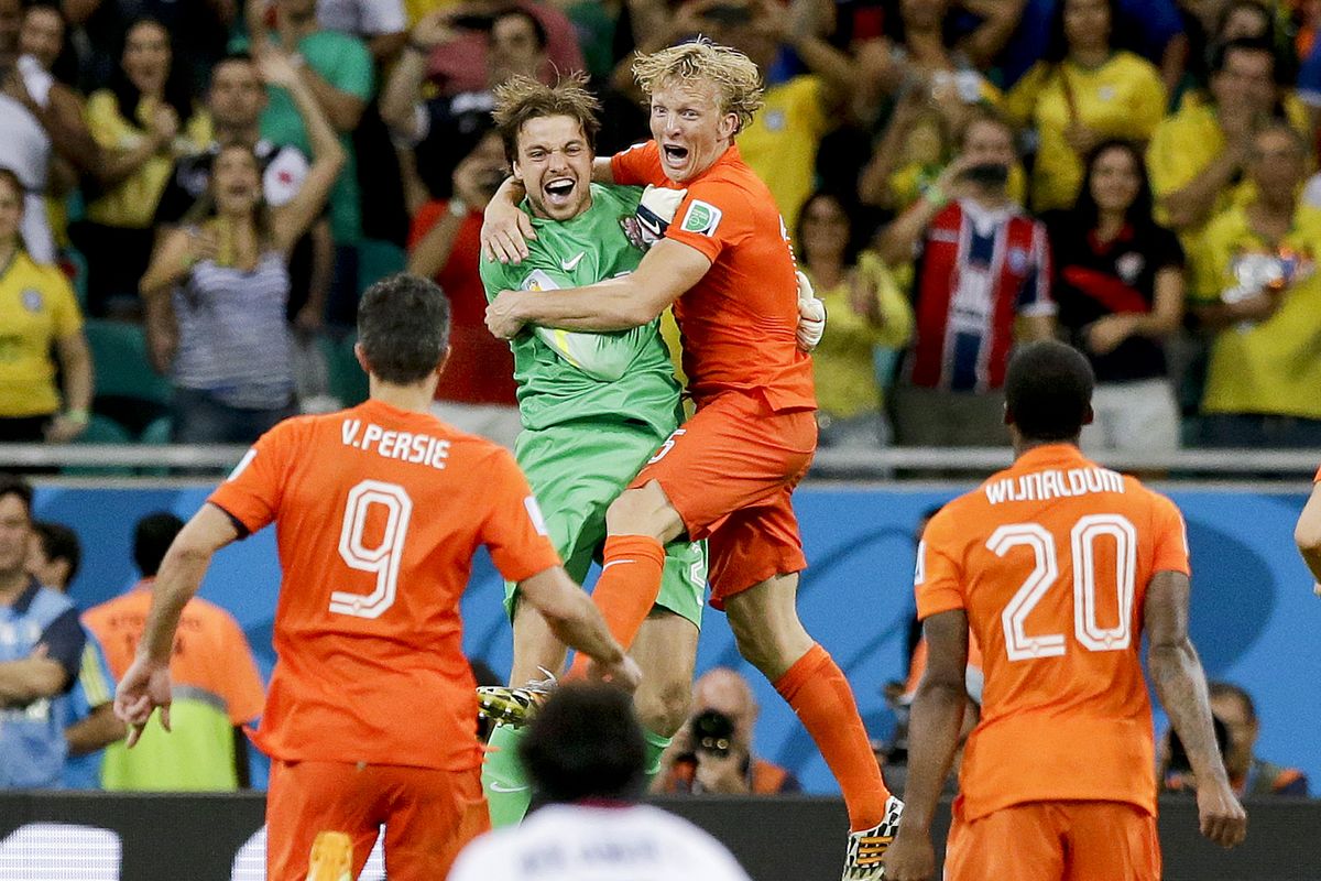 Netherlands goalkeeper Tim Krul, center left, celebrates with Dirk Kuyt after making the final save in the penalty shootout. (AP)