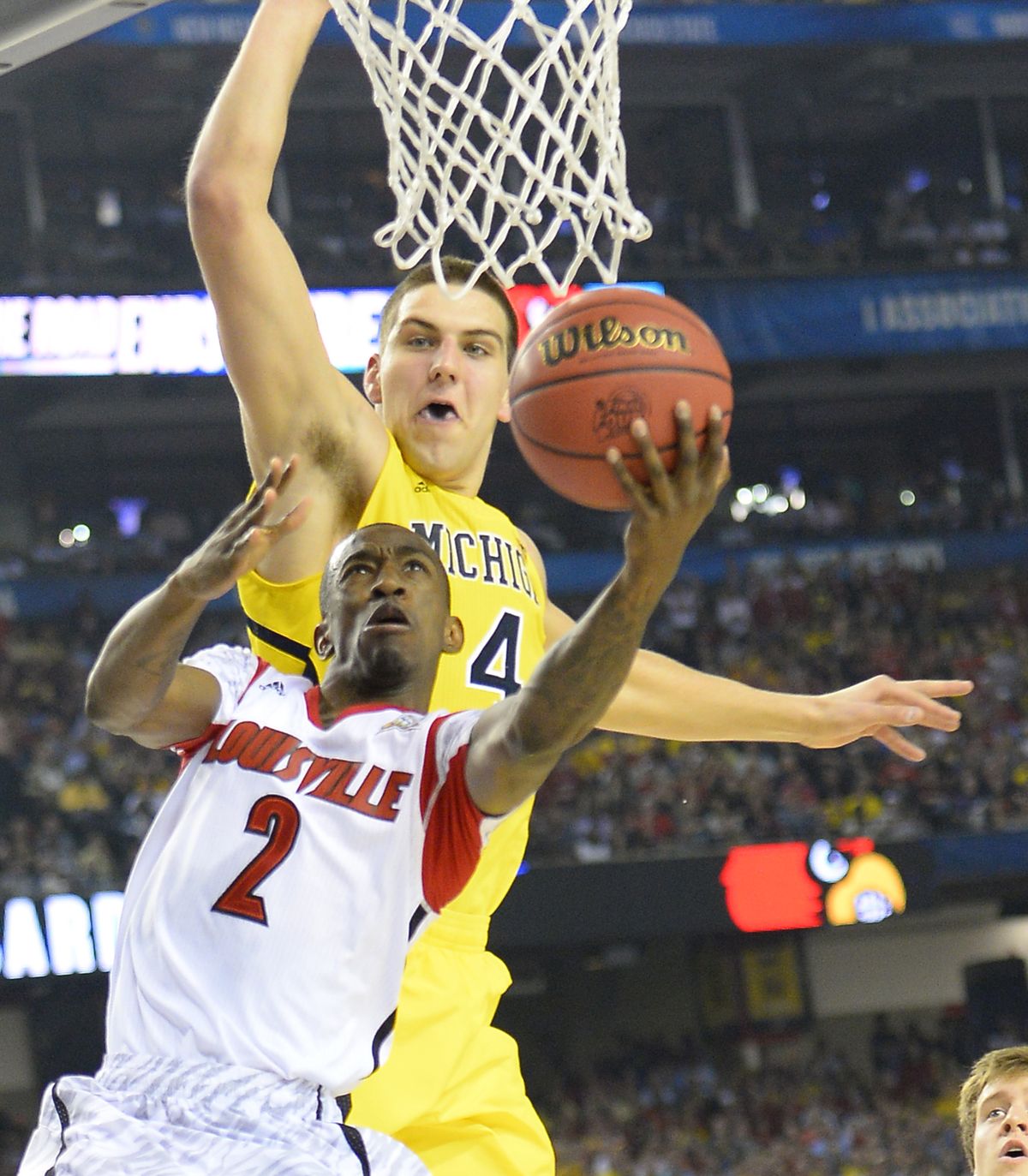 Guard Louisville’s Russ Smith is back to defend the Cardinals’ national title, but he’ll have to get past Michigan’s Mitch McGary.