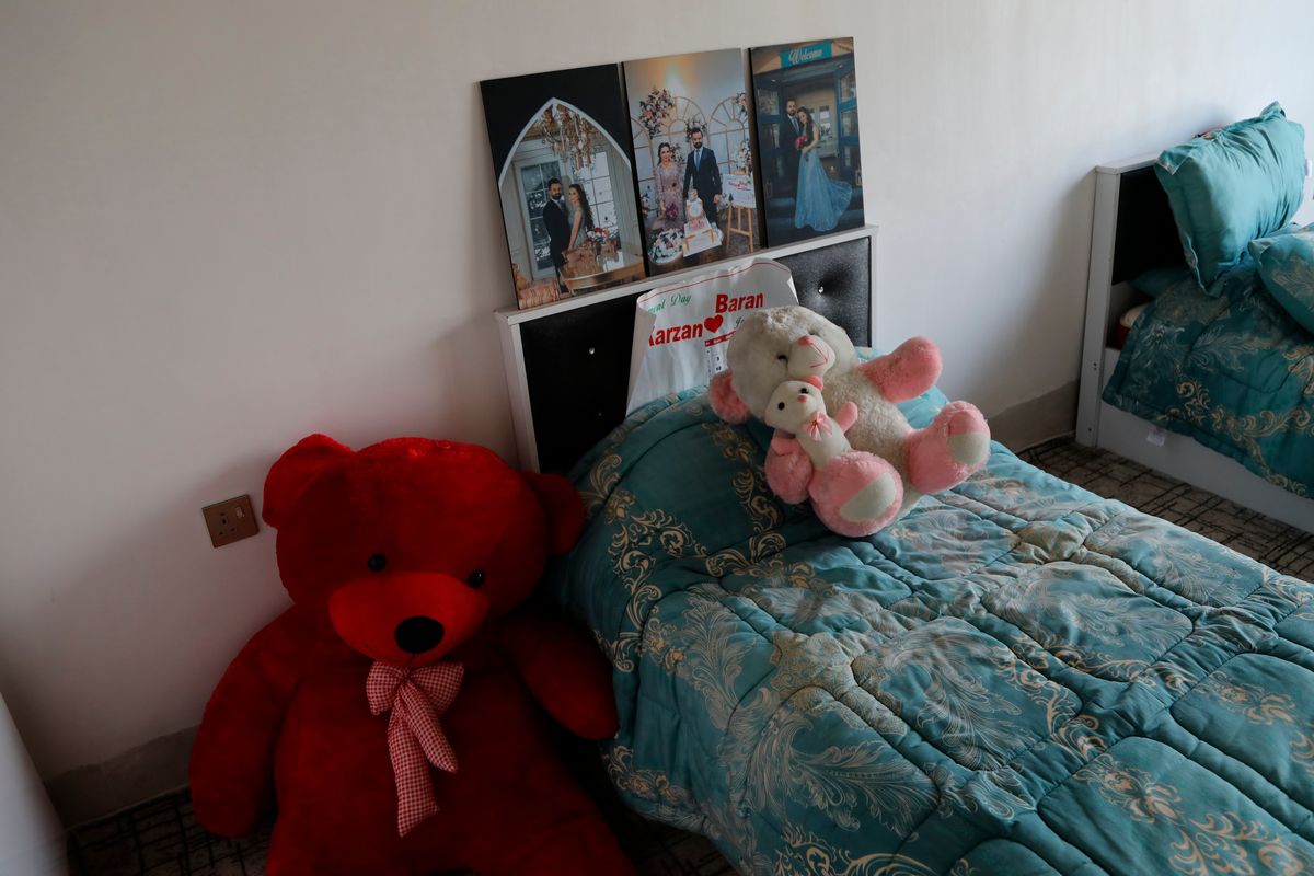 Teddy bears and photos of her betrothed are left behind by Maryam Nouri, who perished this week in an attempt to reach the United Kingdom, in her bedroom of the family home, in the town of Soran in the Kurdish semi-autonomous region of northern Iraq, Sunday, Nov. 28, 2021. Nouri, called Baran by her friends and family, drowned this week along with at least 26 others in the English Channel as she was trying to make the illegal crossing to reunite with her fiancée in the United Kingdom.  (Hussein Ibrahim)