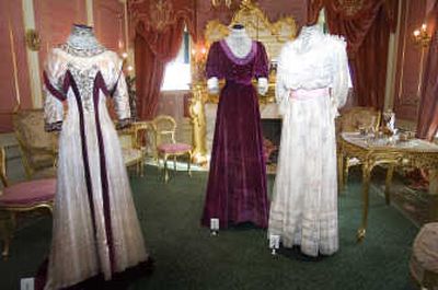 
The Campbell House is decorated for the holidays and features dresses from the 1890s through 1920s from the Northwest Museum of Arts and Culture collection. The plum dress in the middle belonged to Mabel Cotter Williamson, who grew up in Butte and married a Spokane man. The dress was made by a New York designer and features two different bodices.
 (Photos by CHRISTOPHER ANDERSON / The Spokesman-Review)