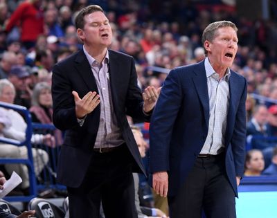 Gonzaga Bulldogs assistant coach Tommy Lloyd, left, and head coach Mark Few react to a call during a 2017 NCAA basketball game.  (Tyler Tjomsland / The Spokesman-Review)