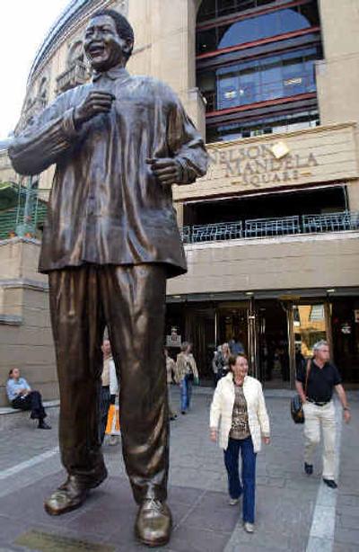 
A statue of former South African President Nelson Mandela on Nelson Mandela Square in Johannesburg. Mandela is locked in a legal battle against his former attorney and close advisor, Ismael Ayob, over what happened to the profits from his art works and whether his signature on a series of prints was forged. 
 (Associated Press photos / The Spokesman-Review)