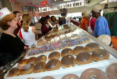 
Troubled doughnut maker Krispy Kreme will restate earnings for the last three quarters of fiscal 2004, the company announced Tuesday. 
 (Associated Press / The Spokesman-Review)