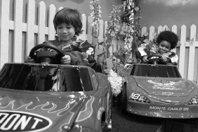 
Jasper Newell, left, in a Jeff Gordon car, and Jalen Stewart, in a Dale Earnhardt Jr. car, demonstrate Nascar Power Wheels from Fisher-Price during the American International Toy Fair Thursday in New York.  
 (Associated Press / The Spokesman-Review)