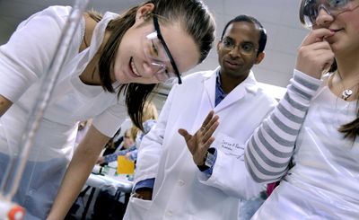 Lake City High School 10th-graders Angelina Ray, left, and Alyssa Santiago work with Dr. Shiva K. Rastogi at the University of Idaho Research Park in Post Falls last week.   (Kathy Plonka / The Spokesman-Review)