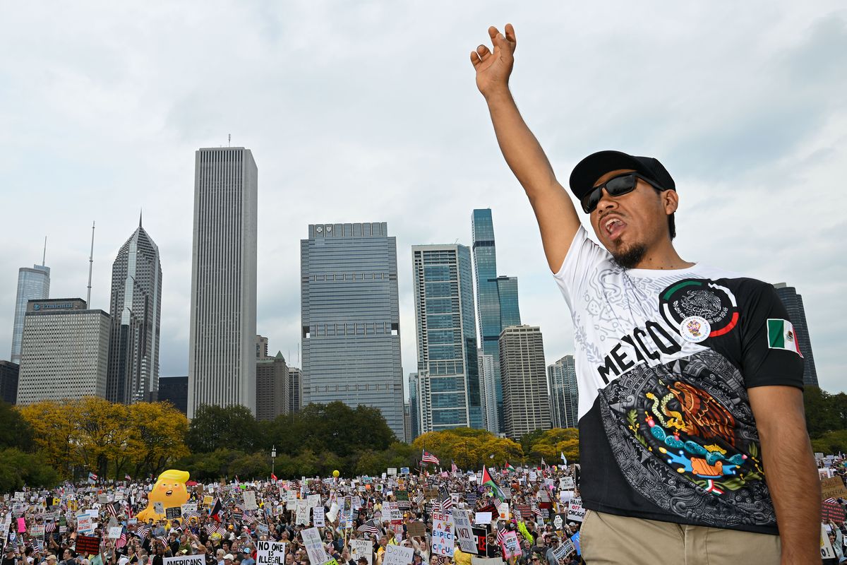 Javier Villalobos joins thousands of demonstrators during a No Kings march in Chicago on Oct. 18.   (Joshua Lott/The Washington Post)