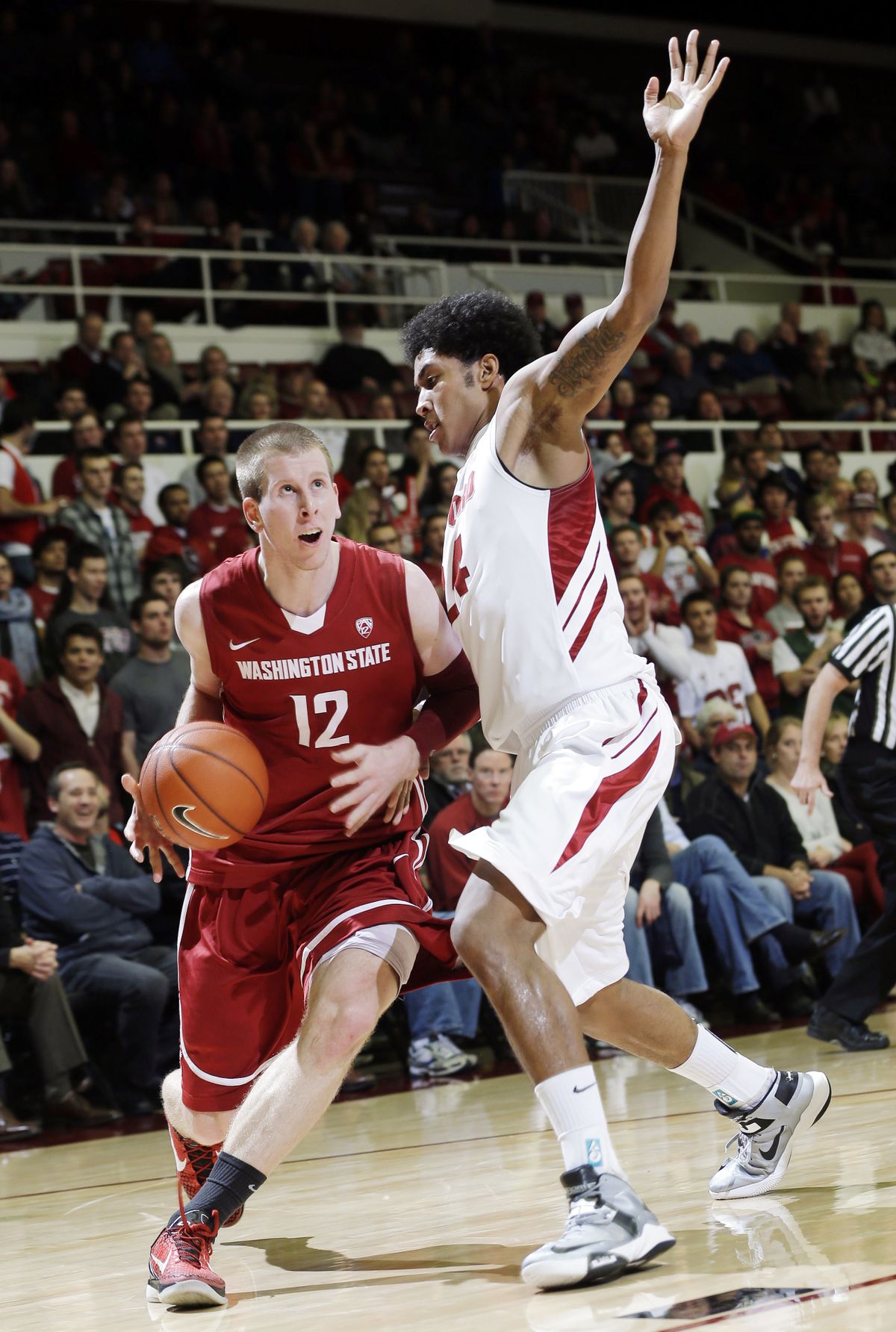 Stanford’s Jush Huestis tries to slow WSU’s Brock Motum. (Associated Press)