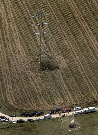 In this aerial photo authorities investigate after a hot air balloon caught on fire and crashed in Central Texas near Lockhart, Texas, Saturday, July 30, 2016. (Rodolfo Gonzalez / Associated Press)