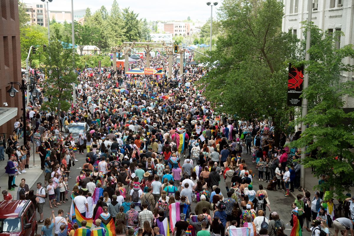 The Spokane Pride Parade finishes with a large group surging into Riverfront Park on Saturday in downtown Spokane. The crowd stayed in Riverfront Park, eating and celebrating for the rest of the afternoon.  (Jesse Tinsley/THE SPOKESMAN-REVIEW)