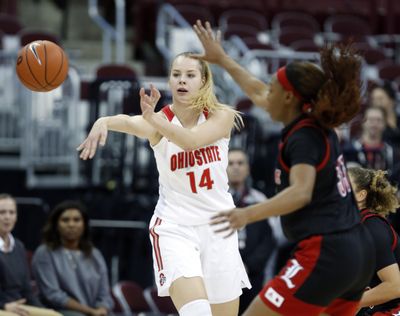 Ohio State forward Dorka Juhasz, left, passes the ball away from Louisville forward Bionca Dunham during the first half of an NCAA college basketball game in Columbus, Ohio, Thursday, Dec. 5, 2019. (Paul Vernon / Associated Press)