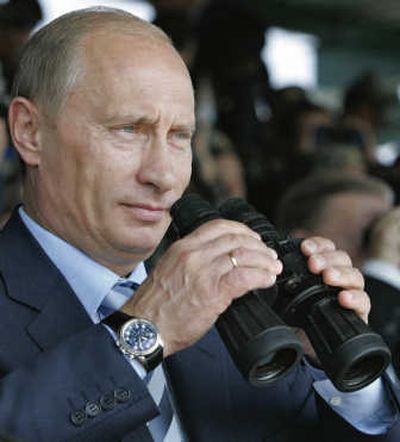 
Russian President Vladimir Putin watches joint military exercises at the Chebarkul testing range on Friday. Associated Press
 (Associated Press / The Spokesman-Review)