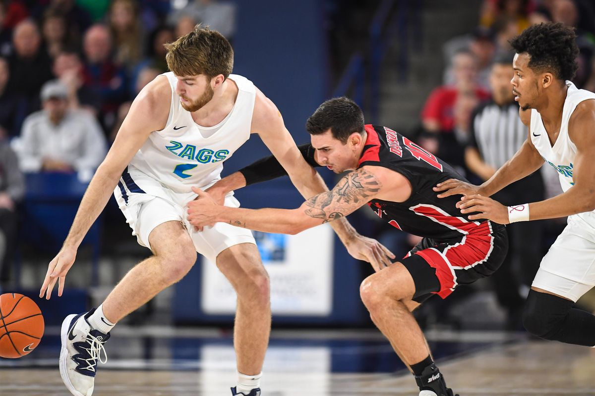 Gonzaga forward Drew Timme, left, and guard Admon Gilder pressure Eastern Washington University guard Jacob Davidson into a turnover, Saturday. Dec. 21, 2019, in the McCarthey Athletic Center. (Dan Pelle / The Spokesman-Review)