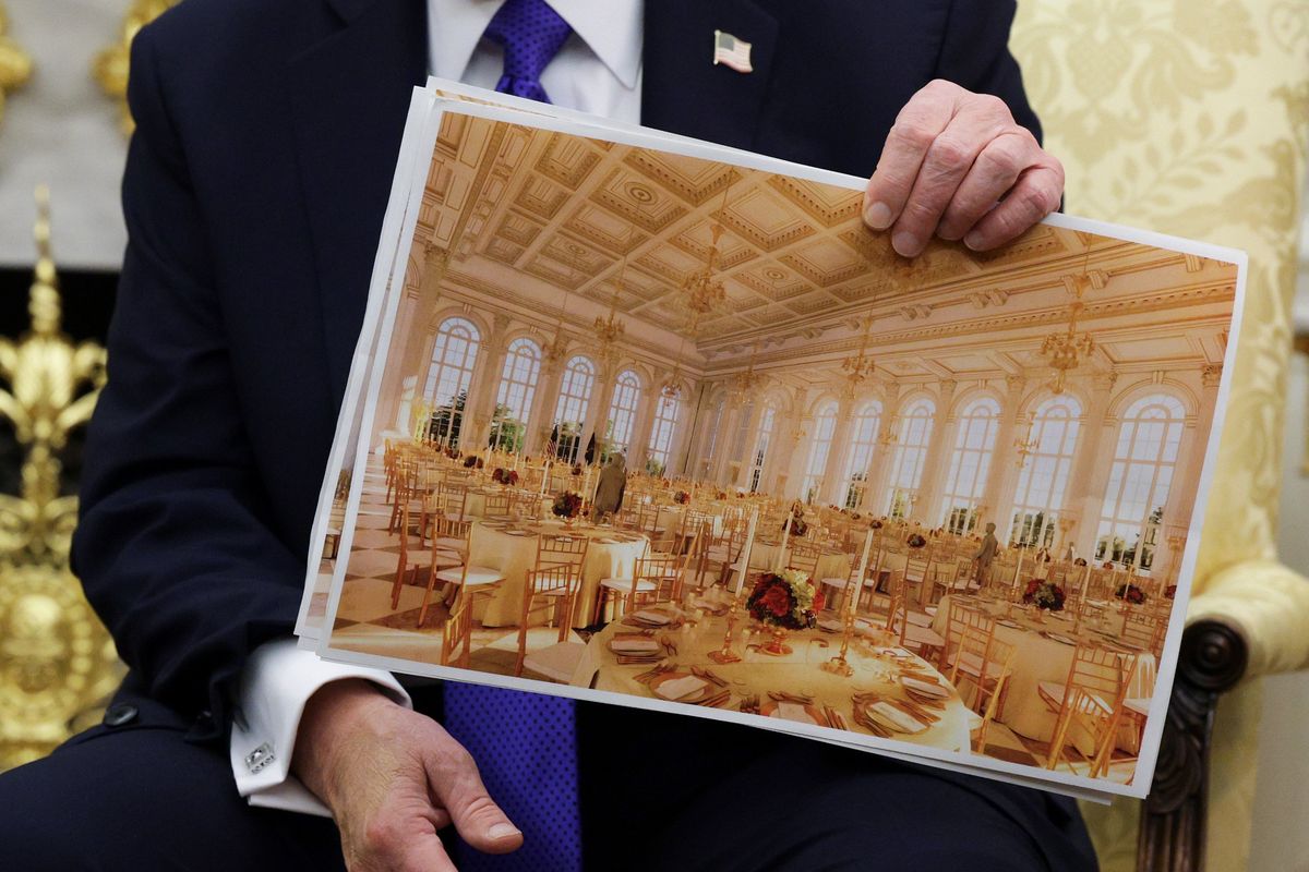 U.S. President Donald Trump displays a rendering of his proposed $250 million White House ballroom as he meets with NATO Secretary-General Mark Rutte in the Oval Office of the White House on Oct. 22, 2025, in Washington, D.C. Less than a week after hosting Ukrainian President Volodymyr Zelenskyy, Trump is meeting with Rutte to discuss the war in Ukraine. (Alex Wong/Getty Images/TNS)  (Alex Wong/Getty Images North America/TNS)
