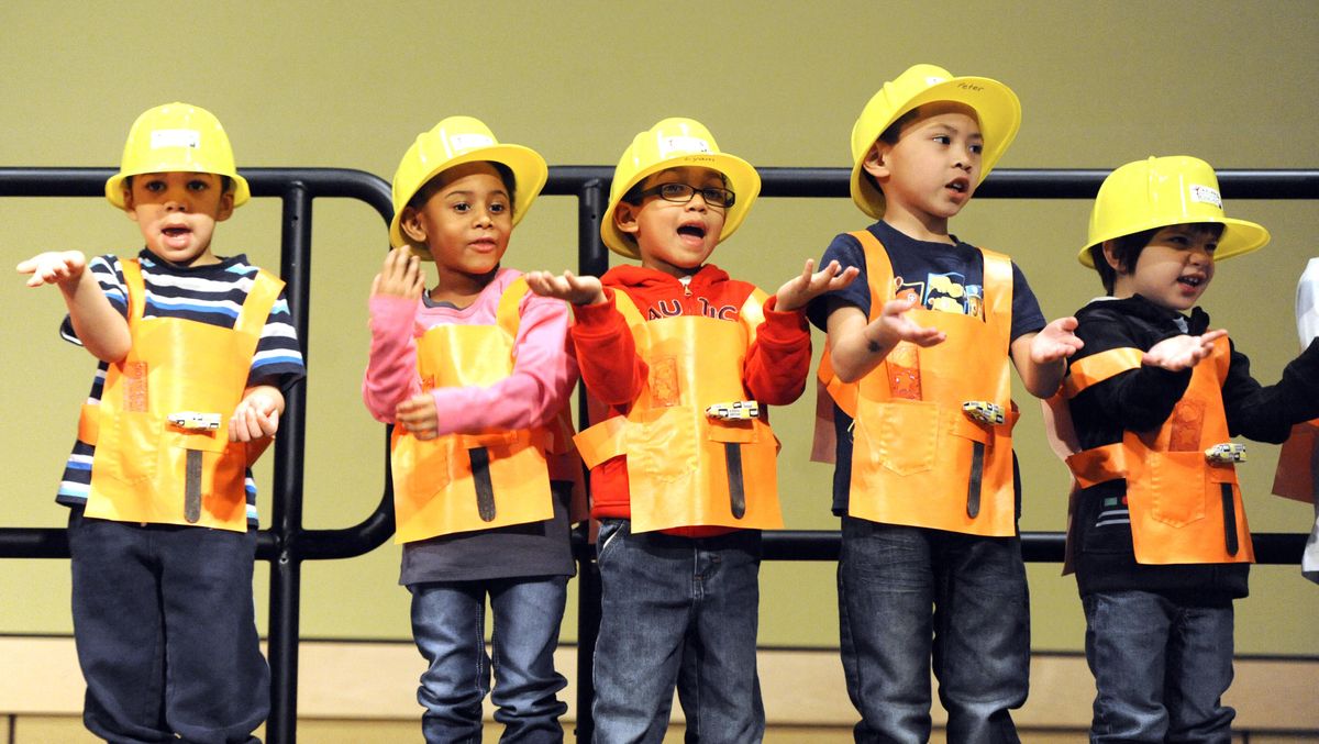 Children from the Martin Luther King Jr. Family Outreach Center perform“If I Had A Hammer” in sign language Monday before the annual Martin Luther King Jr. Day march through downtown Spokane. (Jesse Tinsley / The Spokesman-Review)
