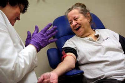 
Roberta Hickson,  right, shares a laugh with WSU research associate Debra Weeks before having her blood drawn at the Riverpoint campus last Tuesday. Hickson is participating in the ACCORD  national study on treatment for type 2 diabetes and cardiovascular disease.
 (Holly Pickett / The Spokesman-Review)