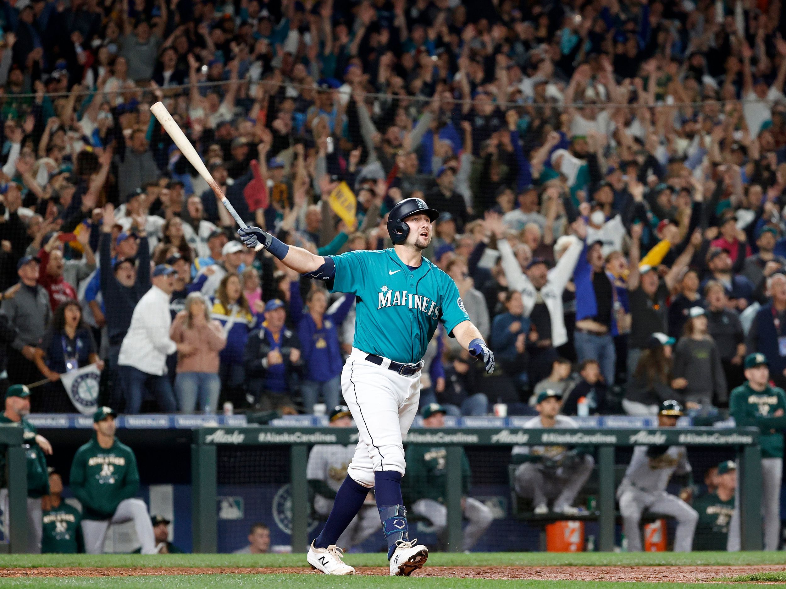 A Seattle Mariners fan wearing a Cal Raleigh jersey with Raleigh's  nickname, Big Dumper, enters T-Mobile Park before an opening day baseball  game between the Seattle Mariners and the Cleveland Guardians Thursday