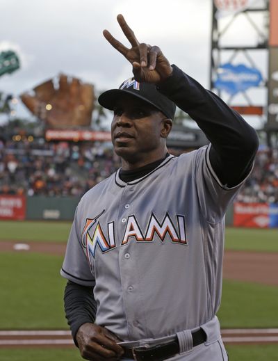 Miami Marlins hitting coach Barry Bonds gestures to fans prior to the Marlins' baseball game against the San Francisco Giants. (Ben Margot / Associated Press)