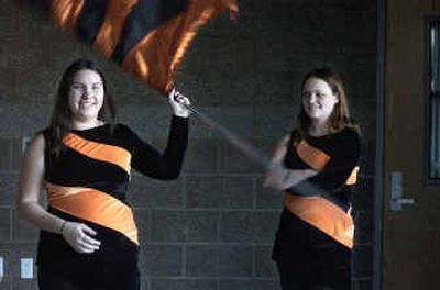 
Post Falls High senior and flag team member Brianna Boyles, left, credits flag team with changing her outlook on life. Her best friend is Nikki Smith, right, who is also on the flag team. 
 (Jesse Tinsley / The Spokesman-Review)