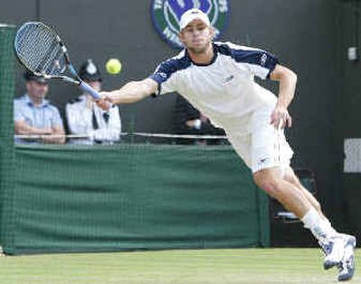 
Andy Roddick plays a return to Alexander Popp during their men's singles match on Monday at Wimbledon.
 (Associated Press / The Spokesman-Review)