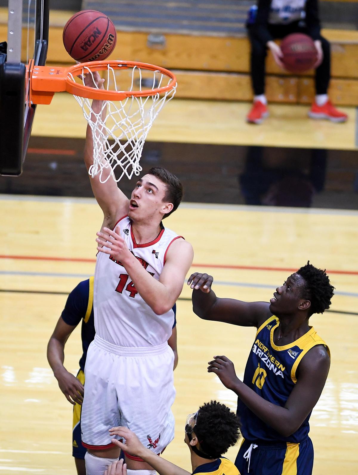Eastern Washington Eagles forward Mason Peatling (14) lays in the ball against the Northern Arizona Lumberjacks during a college basketball game on Saturday, February 22, 2020, at EWU in Cheney, Wash. EWU won the game 80-70. (Tyler Tjomsland / The Spokesman-Review)