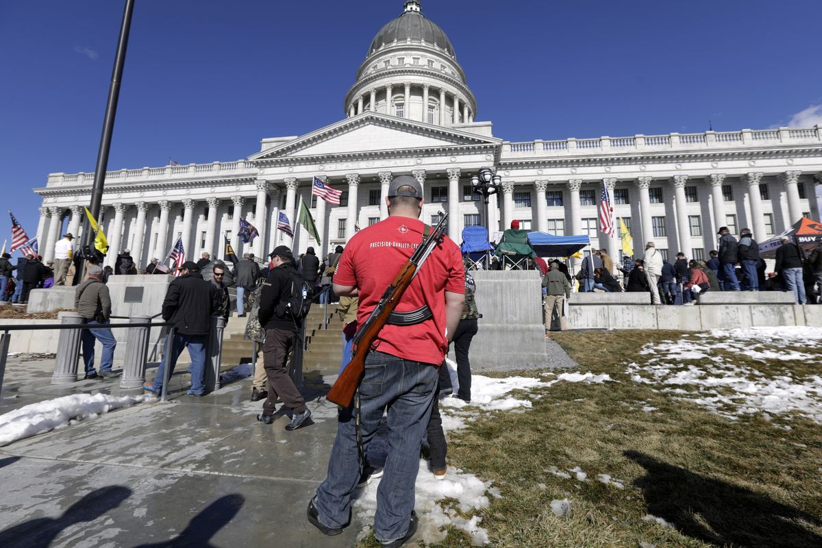 A man carries his weapon at a Second Amendment rally at the Utah State Capitol in February in Salt Lake City.  (Rick Bowmer)