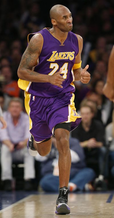 Los Angeles Lakers forward Kobe Bryant runs down court after scoring in the second half of an NBA basketball game against the New York Knicks at Madison Square Garden on Sunday in what might have been his last appearance as a player in the Garden. (Kathy Willens / AP)