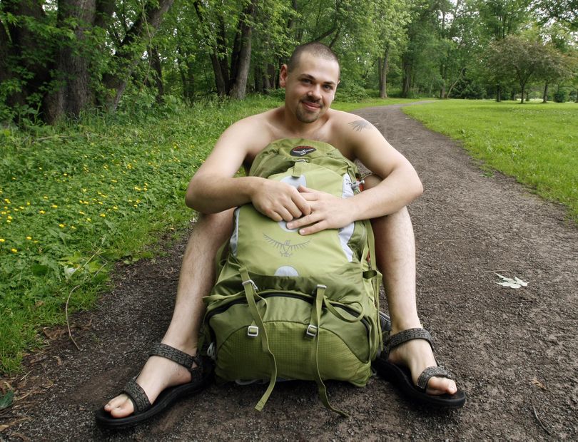 ORG XMIT: PAKS101 Andrew Williams poses without his shirt behind his backpack at a park near his home in Warren, Pa., Thursday, June 18, 2009. Williams plans to participate in Naked Hiking Day, on Sunday June 21, an annual event celebrated on the first day of summer by a relatively few enthusiasts. (AP Photo/Keith Srakocic) (Keith Srakocic / The Spokesman-Review)