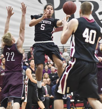 Whitworth guard Kenny Love (5) finds the open man against Puget Sound in last Saturday’s league matchup at Whitworth. Love averages 14.5 points, 3.5 rebounds and a team-leading 3.6 assists for the undefeated Pirates (17-0, 8-0 NWC). (Tyler Tjomsland / The Spokesman-Review)