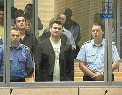 
Milorad Ulemek, center, stands in court in Belgrade on Wednesday. Slobodan Milosevic's paramilitary commander,  Ulemek and 11 other men were convicted  of assassinating Serbia's first democratically elected prime minister, Zoran Djindjic. 
 (Associated Press / The Spokesman-Review)