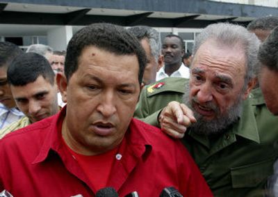 
Venezuelan President Hugo Chavez and President Fidel Castro, speak before Chavez left for Jamaica from Jose Marti airport in Havana Tuesday. 
 (Associated Press / The Spokesman-Review)