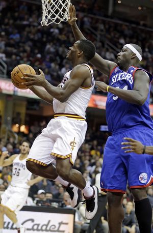Cleveland’s Jeremy Pargo, who scored a career-high 28 points, drives past Philadelphia’s Kwame Brown for a shot. (Associated Press)