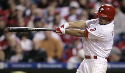 Phillies’ Shane Victorino hit a grand slam and doubled twice. (Associated Press / The Spokesman-Review)