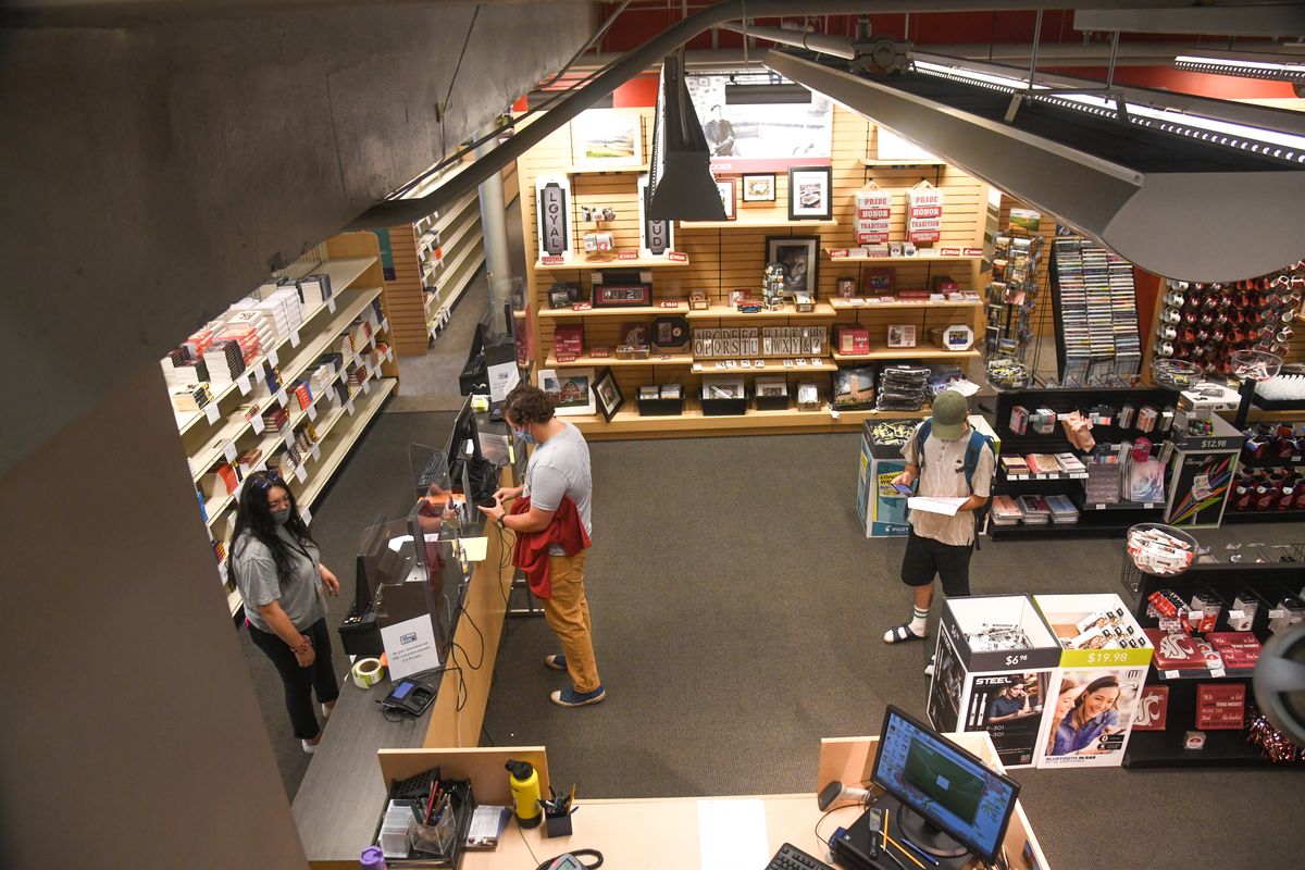 Lines were very short as Washington State University students pick up their books at the counter in the WSU Bookie on the first day of school, Monday, Aug. 24, 2020, in Pullman, Wash.  (DAN PELLE/THE SPOKESMAN-REVIEW)