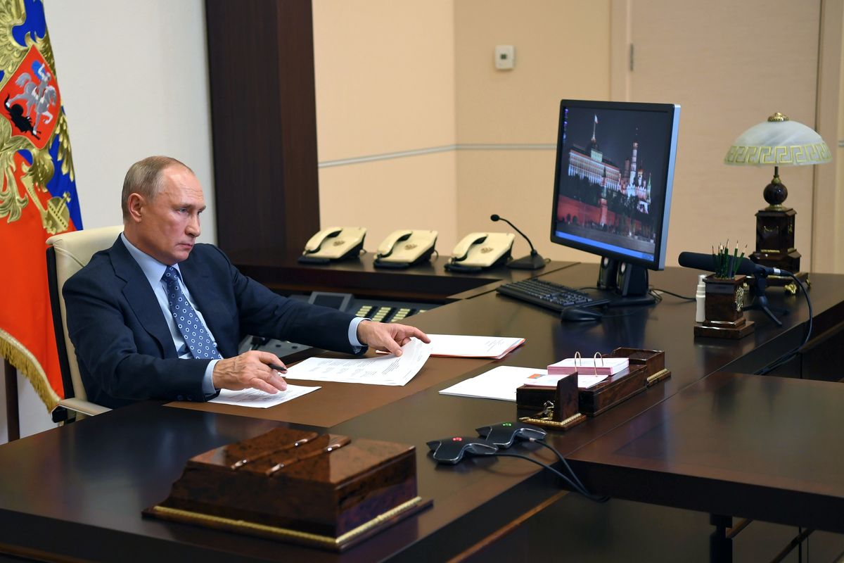 Russian President Vladimir Putin attends a meeting via video conference at the Novo-Ogaryovo residence outside Moscow, Russia, Tuesday, Dec. 8, 2020.  (Alexei Nikolsky)