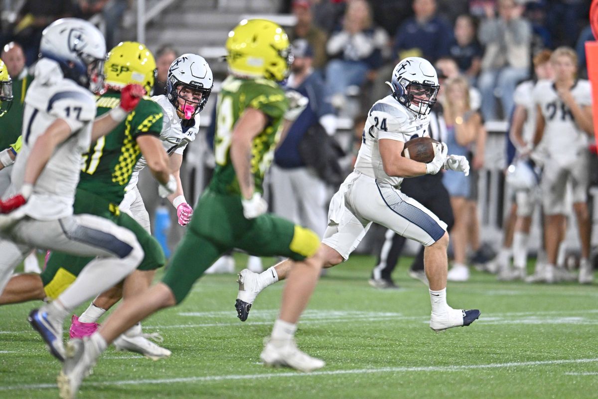 Gonzaga Prep’s Jimmy Grainger rushes for a touchdown against Shadle Park during a GSL game on Oct. 9 at ONE Spokane Stadium.  (James Snook/For The Spokesman-Review)