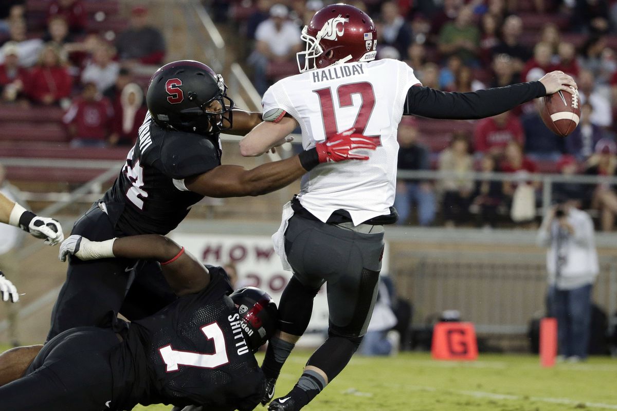 Washington State quarterback Connor Halliday was sacked four times Friday night, this time by Stanford linebacker Peter Kalambayi. (Associated Press)