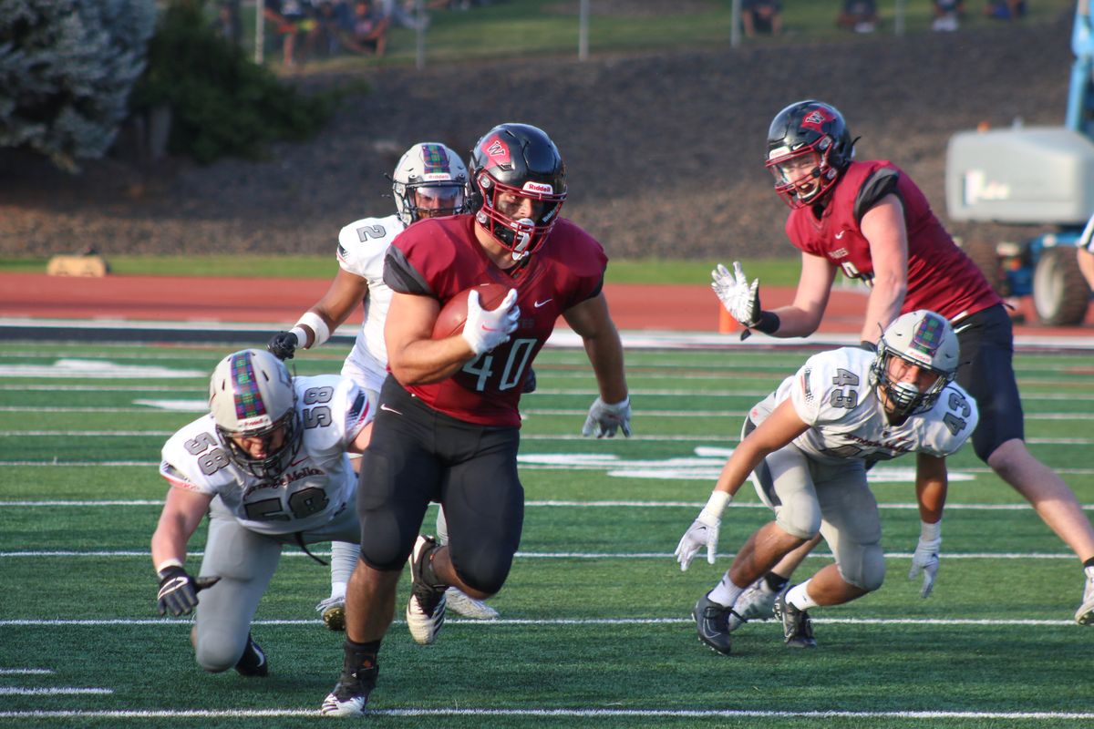 Whitworth’s Logan Kitselman breaks free for a 17-yard reception in the Pirates’ 13-10 home win over Carnegie Mellon on Friday.  (Courtesy Steve Flegel/Whitworth Athletics)