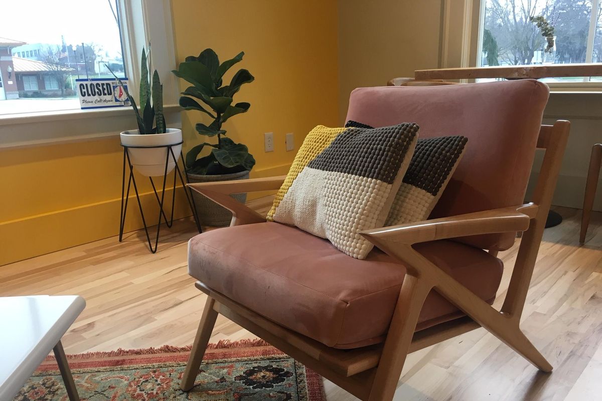 Ladder Coffee and Toast, newly opened in Browne’s Addition, features a mid-century modern look complete with a pair of pink velveteen chairs, one of which is shown here. (Adriana Janovich / The Spokesman-Review)