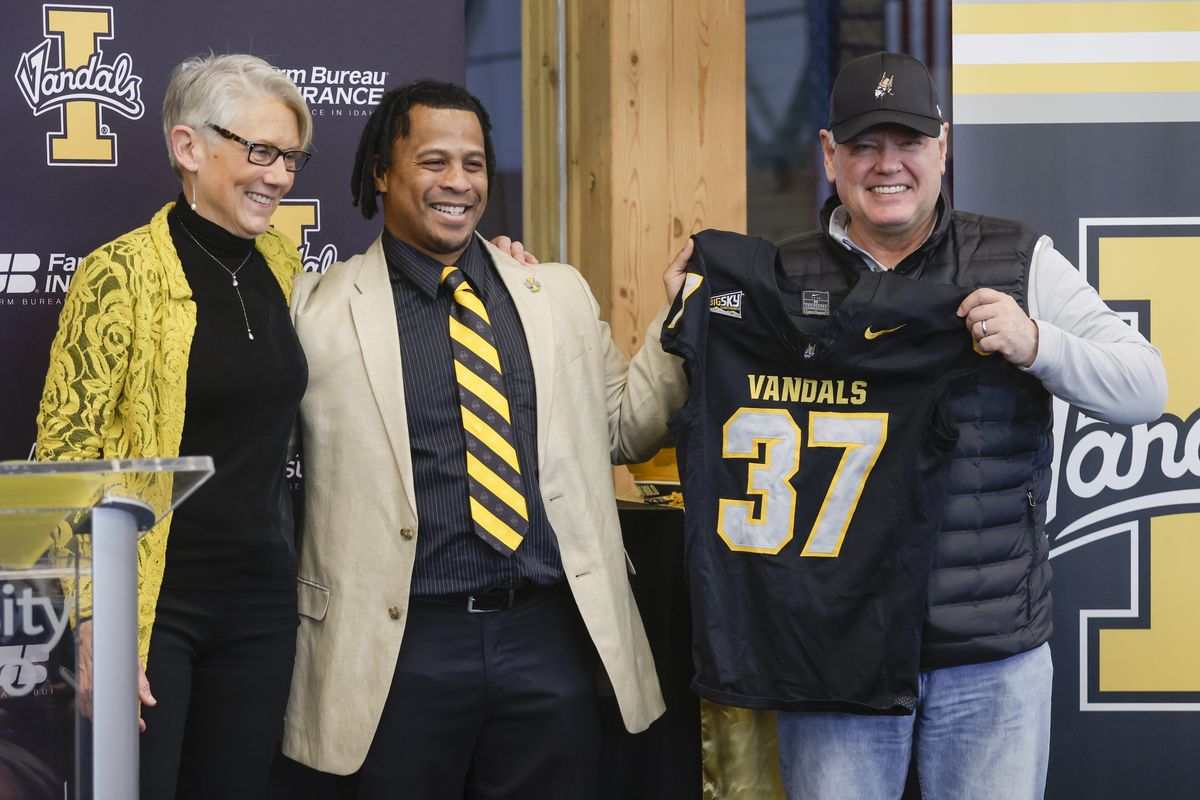 University of Idaho President Scott Green, right, and athletic director Terry Gawlik, left, introduce Thomas Ford as the new head football coach on Friday, Dec. 20, 2024 in Moscow, Idaho.  (Geoff Crimmins/For The Spokesman-Review)