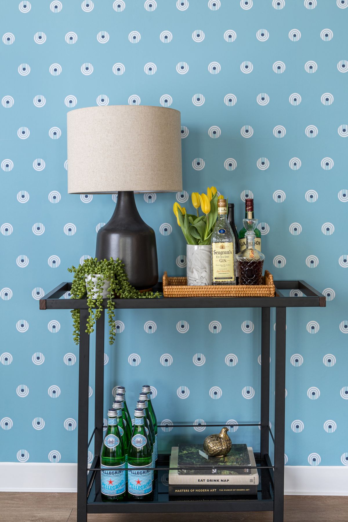 Removable wallpaper, like this Dot Comb Blue design by Chasing Paper, is an easy and affordable way to add color to walls.  (Anna Spaller)
