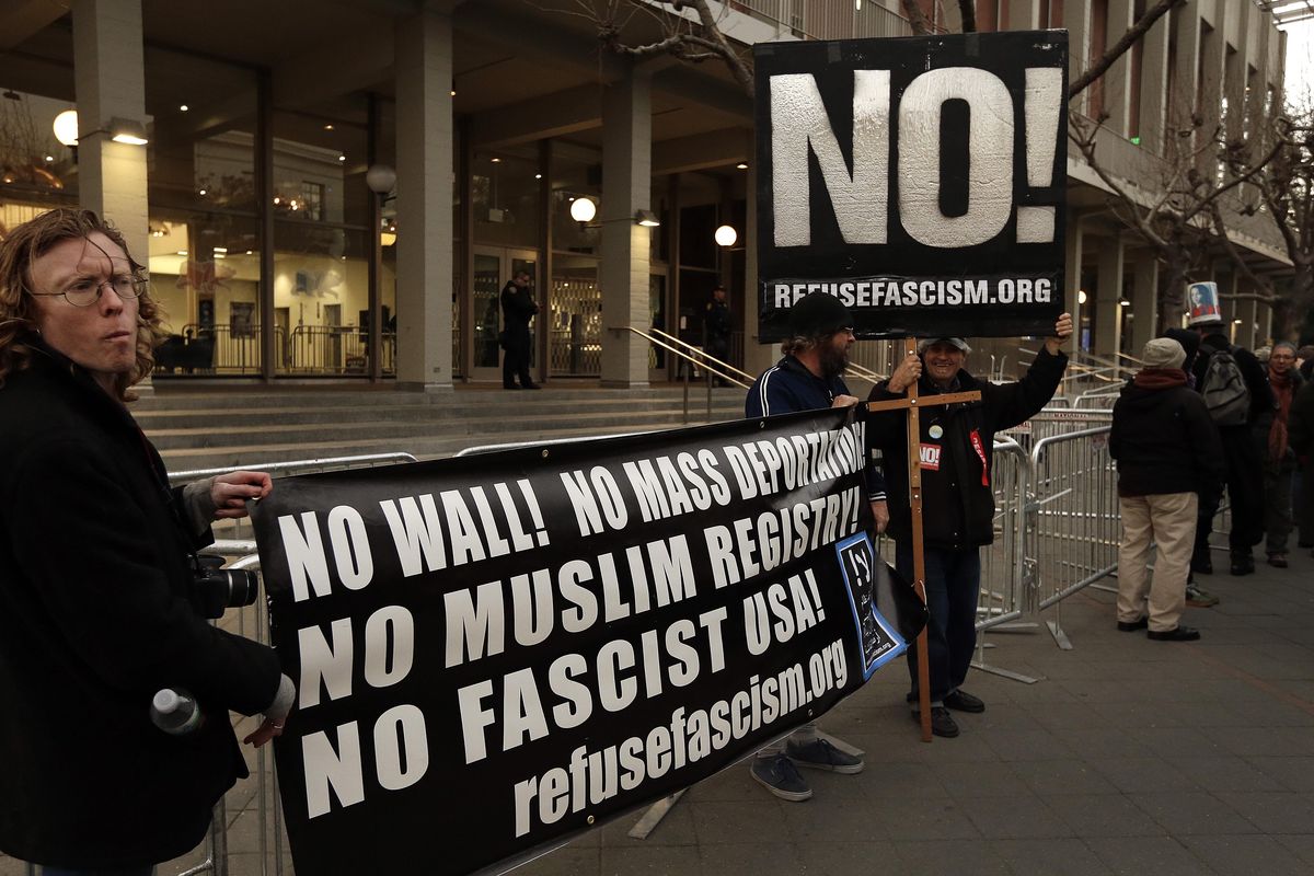 People protest the appearance of Breitbart News editor Milo Yiannopoulos on Wednesday, Feb. 1, 2017, in Berkeley, Calif. (Ben Margot / Associated Press)