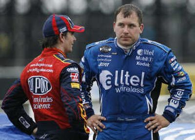 NASCAR driver Ryan Newman, right, looks at Jeff Gordon, during a rain delay at the NASCAR Pocono 500.
(Associated Press / The Spokesman-Review)
