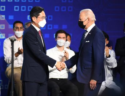 US President Joe Biden, right, shakes hands with Samsung Electronics Co. Vice Chairman Lee Jae-yong, in Pyeongtaek, South Korea, on May 20, 2022.  (Associated Press )