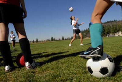
Soccer star Brandi Chastain demonstrates a header during the River City S.C.  clinic at Plantes Ferry Park in Spokane Valley.
 (Photos by Brian Plonka / The Spokesman-Review)