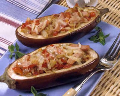 
In this recipe, vegetables, meat and cheese are combined and nicely herbed and spiced. Look for 8-inch eggplants to have four main-dish or eight side-dish servings.
 (King Features Syndicate / The Spokesman-Review)