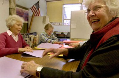 
Lois Carlson, front right, shares a laugh with Midge Thysell, left and Mary Sorenson, center, while volunteering at Sorensen Elementary in Coeur d'Alene. 
 (Kathy Plonka / The Spokesman-Review)