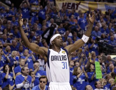 Mavericks' Jason Terry had the championship trophy tattooed onto the inside of his right biceps. (Associated Press)