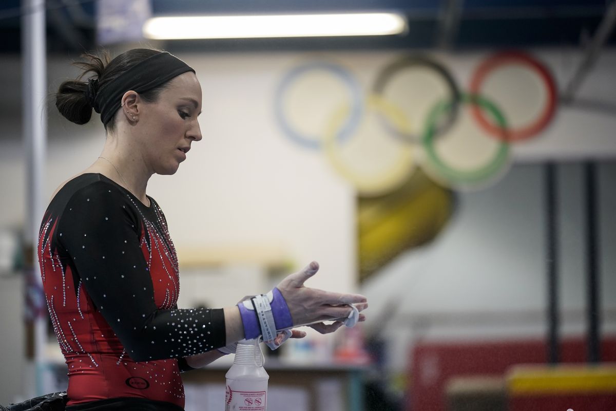 Chellsie Memmel works out Thursday, Feb. 18, 2021, in New Berlin, Wis. Memmel started doing gymnastics again when the COVID-19 pandemic hit last spring because it felt like one of the few things in her life she could control. The 32-year-old former world champion and Olympic silver medalist discovered more than an outlet for stress.  (Associated Press)