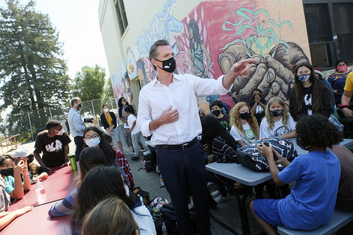 Gov. Gavin Newsom meets with students at Melrose Leadership Academy, a TK-8 school in Oakland, Calif., on Wednesday, Sept. 15, 2021, one day after defeating a Republican-led recall effort. The recall election that once threatened Newsom