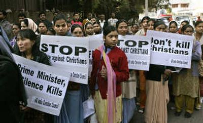 
Indian Christians  march Thursday in New Delhi to protest violence targeting  churches  in Orissa state. Associated Press
 (Associated Press / The Spokesman-Review)